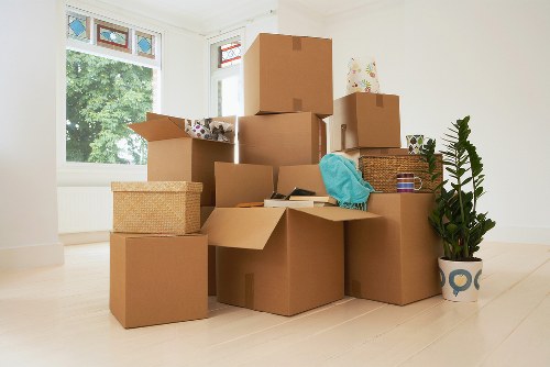 Professional movers loading furniture for a Cowley move